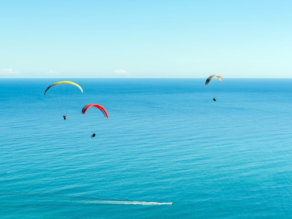Side: Paragliding Experience By Local Expert Pilots w/Hotel Pickup | ®ExcursionMania
