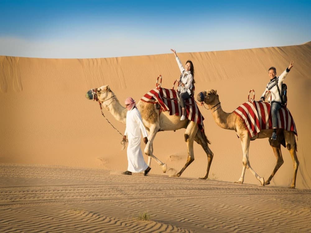 Doha: Safari Camel Ride Sandboarding and Inland Sea Tour | ®ExcursionMania