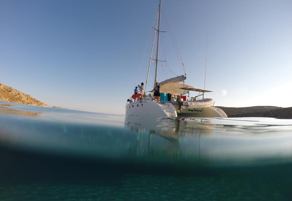 Mykonos Bliss: Catamaran Cruise to Rhenia Island with Meal & Drinks | ®ExcursionMania
