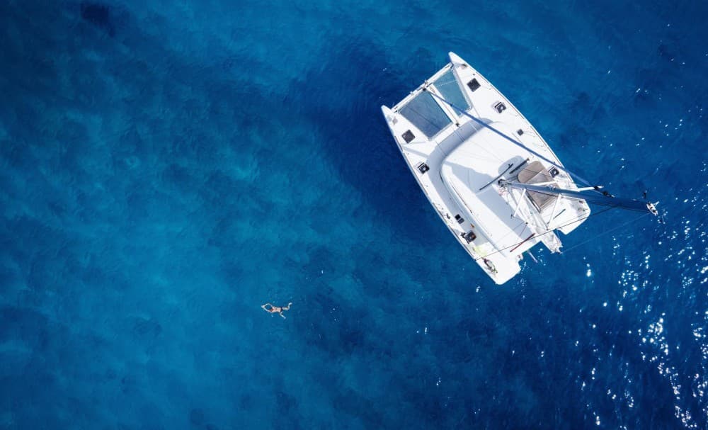 Mykonos Bliss: Catamaran Cruise to Rhenia Island with Meal & Drinks | ®ExcursionMania