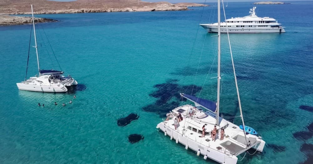 Mykonos Bliss: Catamaran Cruise to Rhenia Island with Meal & Drinks | ®ExcursionMania