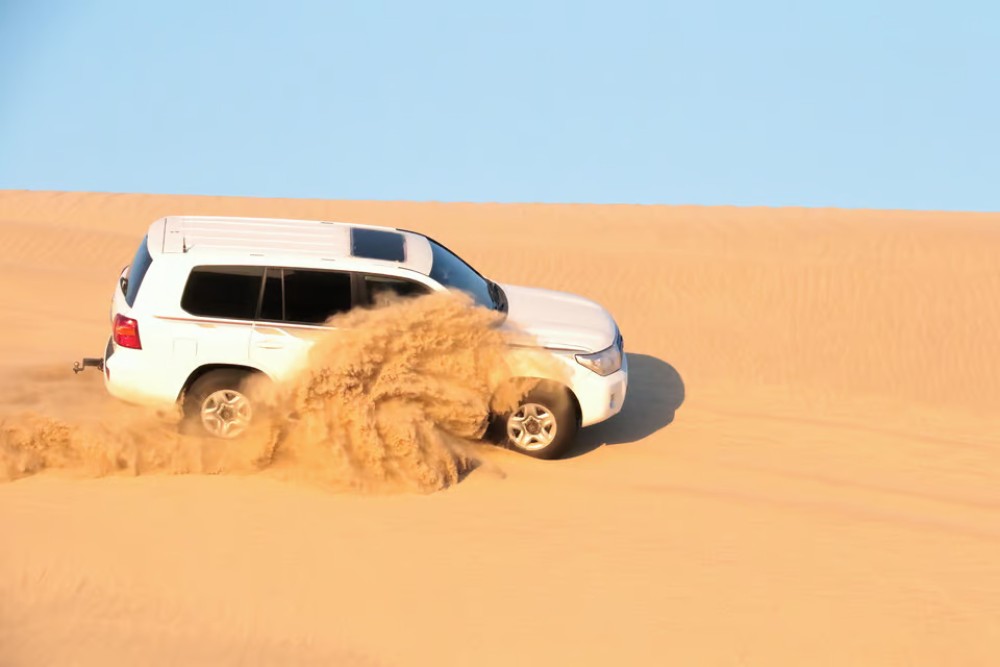Doha: Desert Safari w/ Quad Bike Sandboarding  Camel Ride | ®ExcursionMania