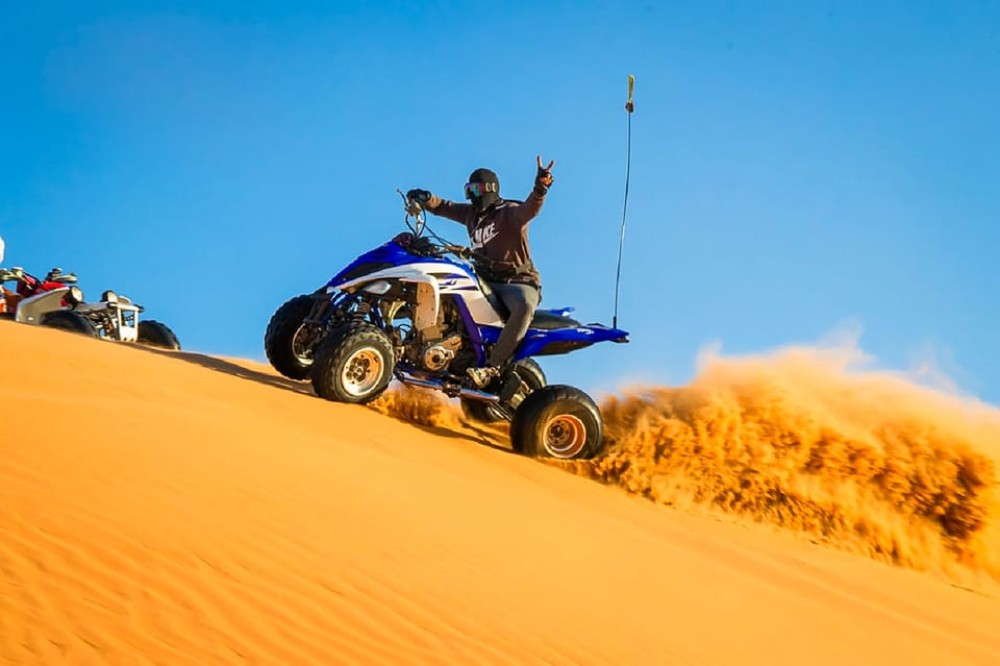 Dubai: Safari Quad Bike Camel Ride and Buffet Dinner | ®ExcursionMania