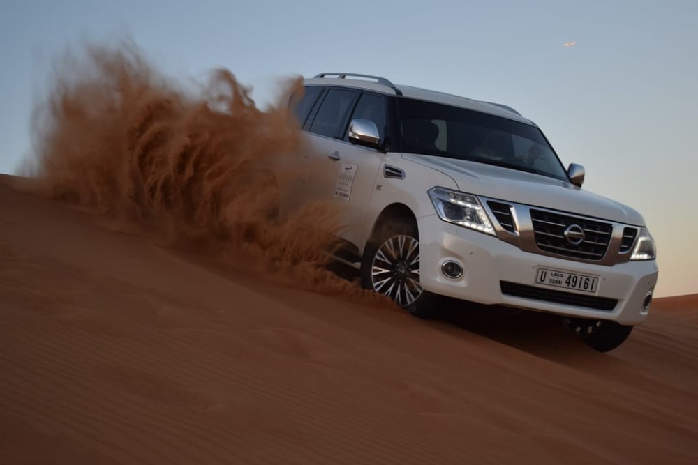 Dubai: Desert Safari Quad Bike Camel Ride and Sandboarding | ®ExcursionMania