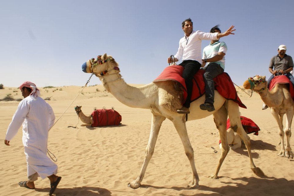 Dubai: Desert Safari Quad Bike Camel Ride and Sandboarding | ®ExcursionMania