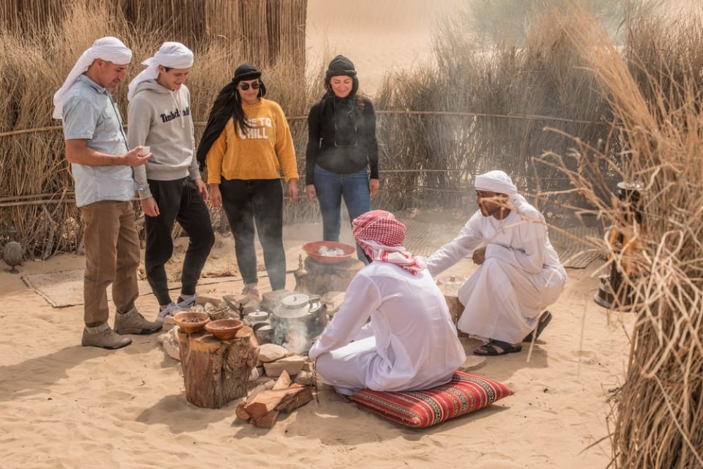 Dubai: Evening Camel Trekking & Dinner at Al Marmoom Oasis | ®ExcursionMania