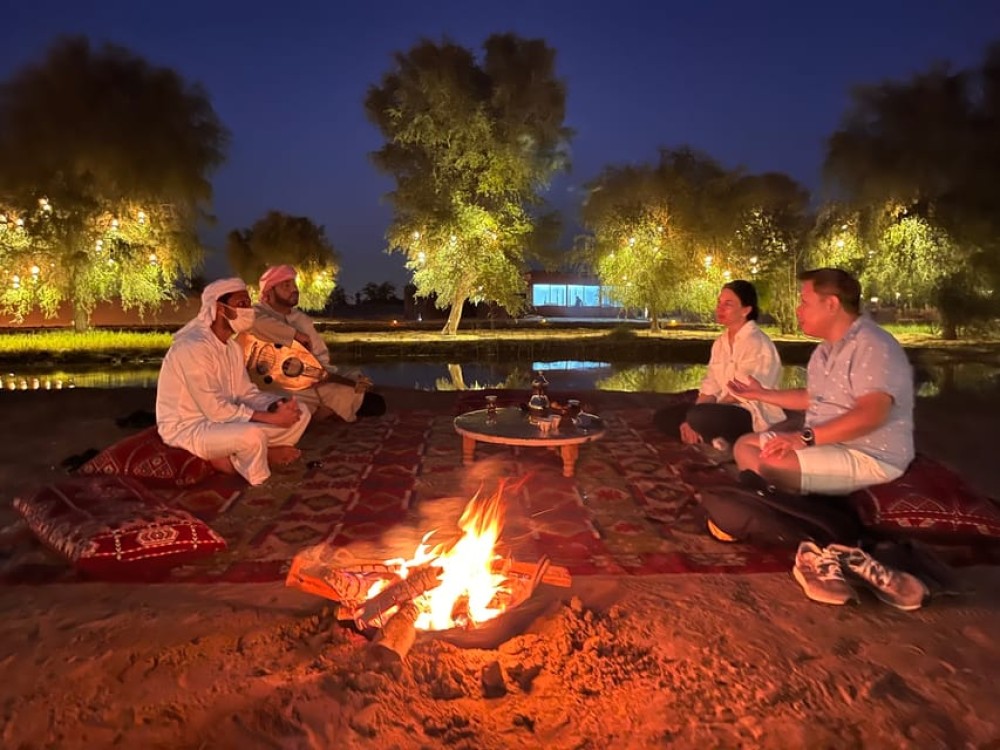 Dubai: Evening Camel Trekking & Dinner at Al Marmoom Oasis | ®ExcursionMania