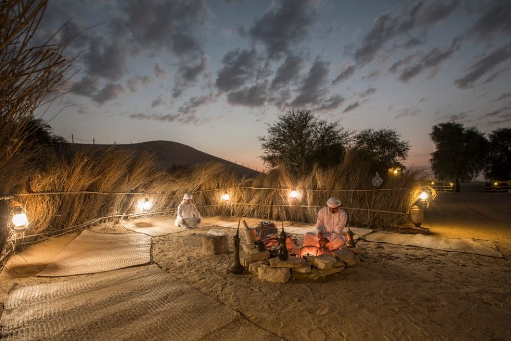 Dubai: Evening Camel Trekking & Dinner at Al Marmoom Oasis | ®ExcursionMania
