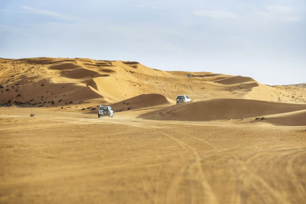 From Muscat: North Dunes and Wadi Hot Spring Tour with Lunch | ®ExcursionMania