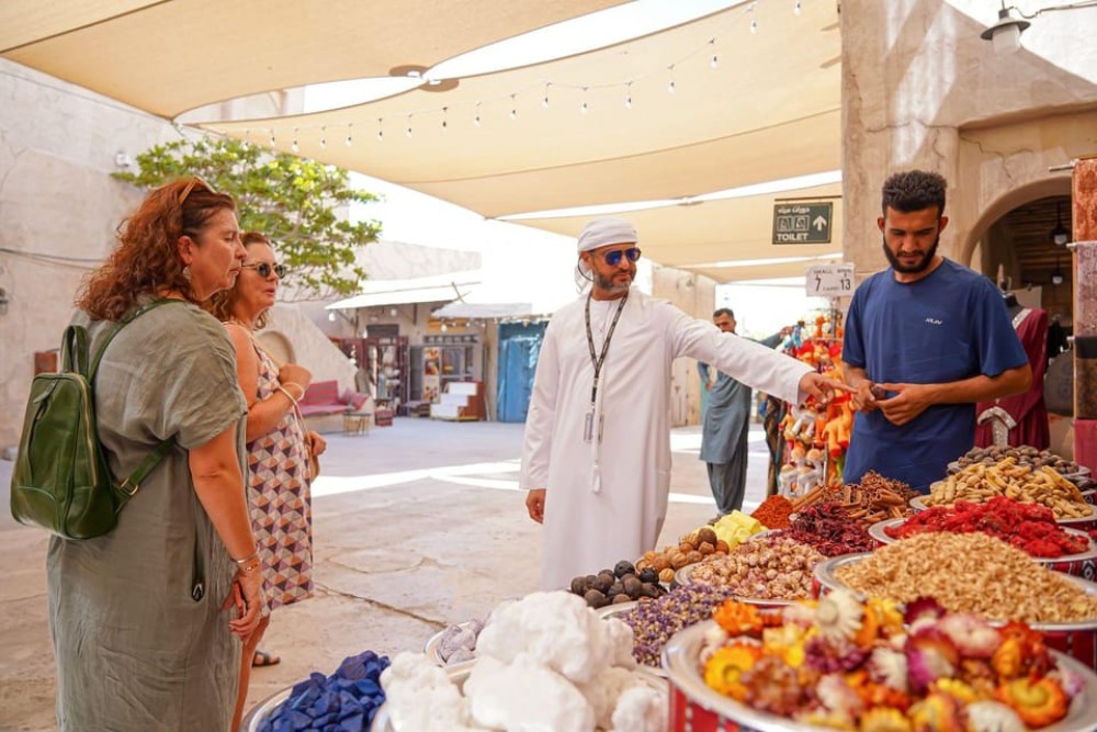 Dubai: Helicopter Ride, Old Town Walking Tour, Abra & Snacks | ®ExcursionMania