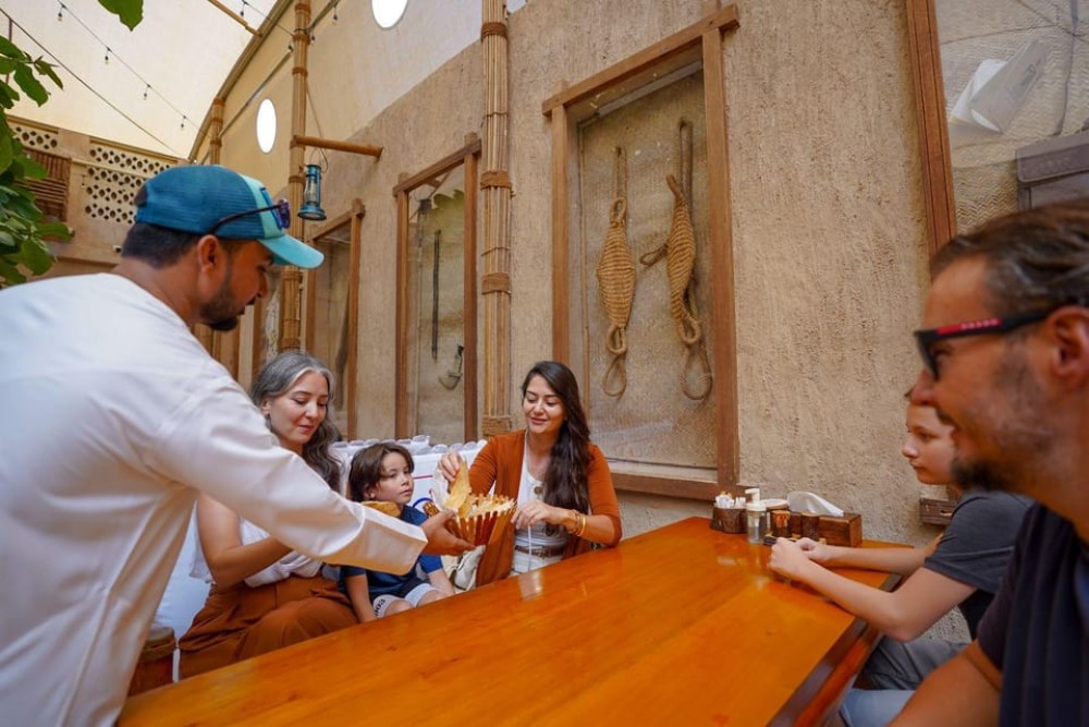 Dubai: Helicopter Ride, Old Town Walking Tour, Abra & Snacks | ®ExcursionMania