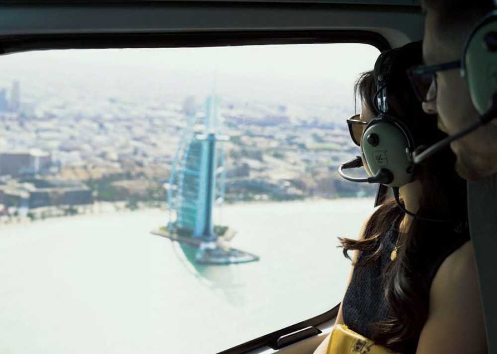 Dubai: Helicopter Ride, Old Town Walking Tour, Abra & Snacks | ®ExcursionMania