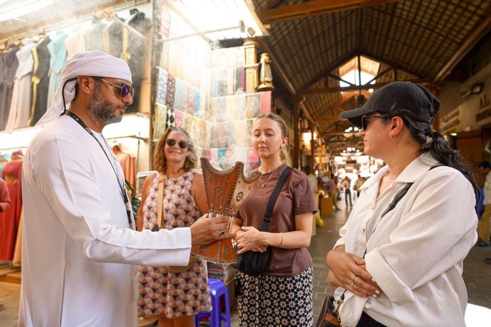 Dubai: Helicopter Ride, Old Town Walking Tour, Abra & Snacks | ®ExcursionMania