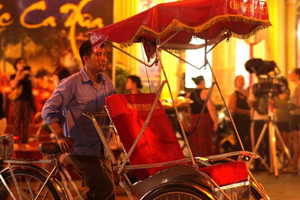 Private Evening Cyclo Tour with Water Puppet Show | ®ExcursionMania