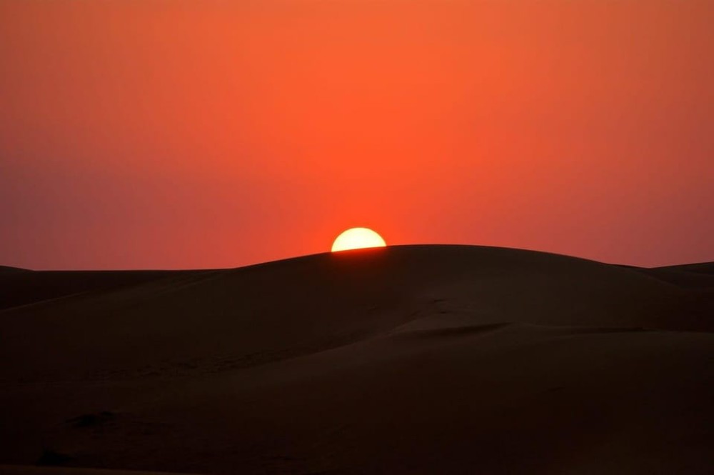 Doha: Nighttime Desert Safari with Dune Bashing & Camel Ride | ®ExcursionMania