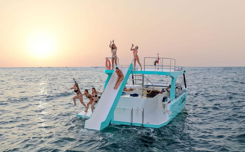 Slide, Cruise & Party on JUMP Private Yacht with BBQ&Drinks | ®ExcursionMania