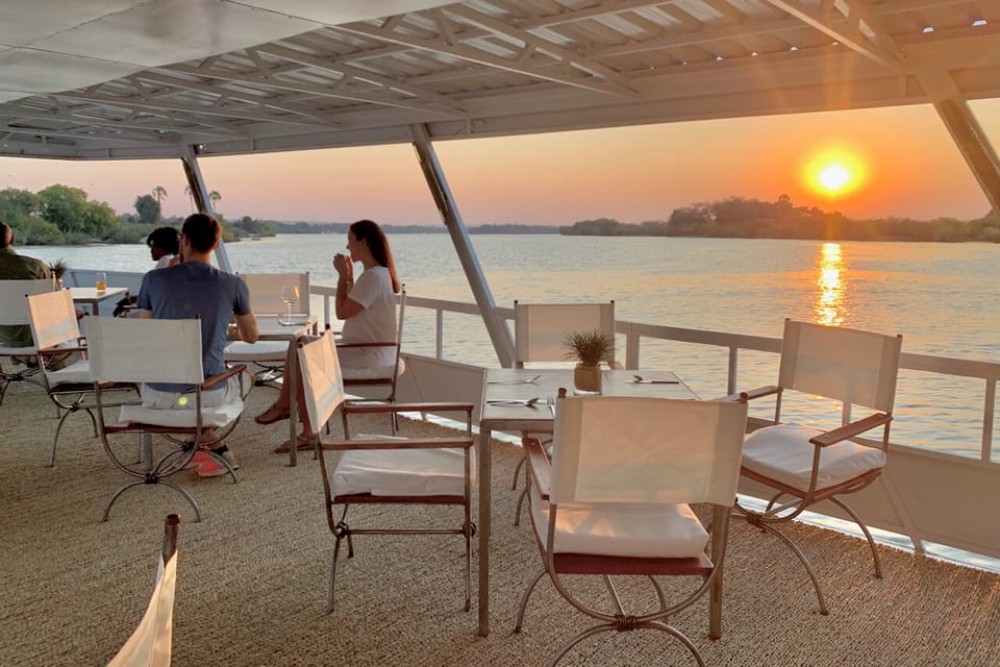 Victoria Falls Guided Tour  Sunset Boat Cruise | ®ExcursionMania