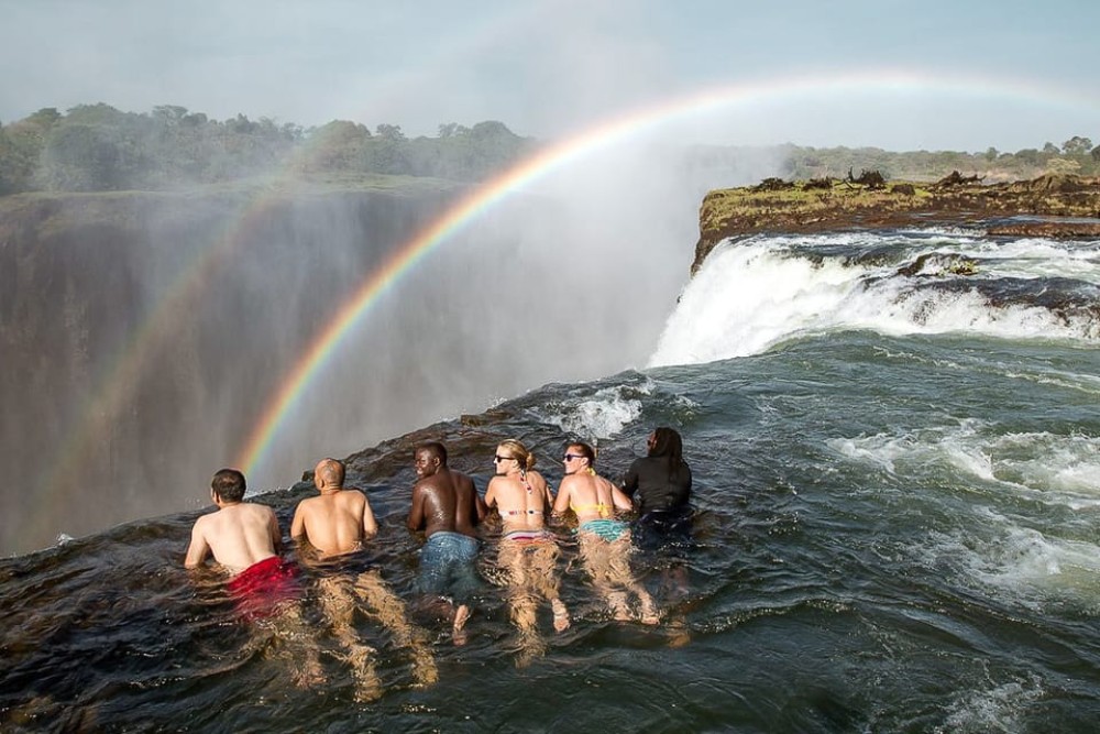 From Victoria Falls: Livingstone Island Tour & Devils Pool | ®ExcursionMania
