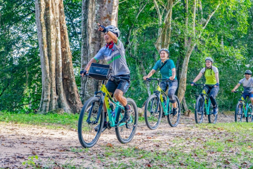 Siem Reap: Angkor Sunset Bike & Boat Tour w/ Drinks & Snacks | ®ExcursionMania