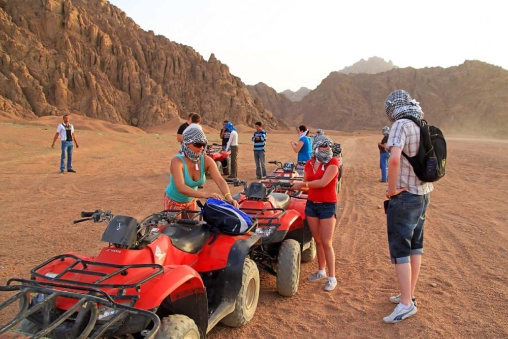 Hurghada Sunset Desert Safari with Quad Bike and Camel Ride | ®ExcursionMania
