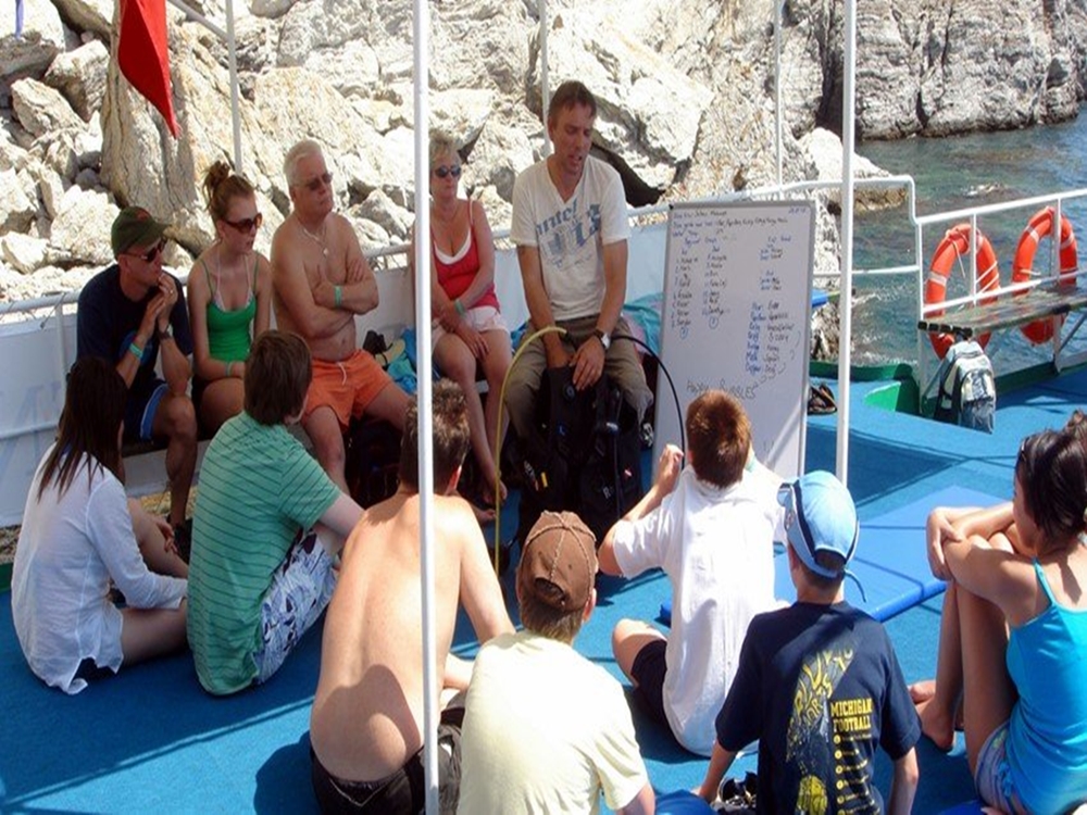 Scuba Diving Adventure in the Crystal-Clear Waters of Kaş | ®ExcursionMania