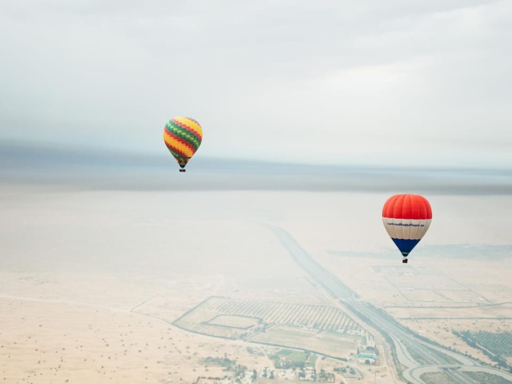 Dubai: Sunrise Balloon Flight with Camel Ride  Breakfast | ®ExcursionMania