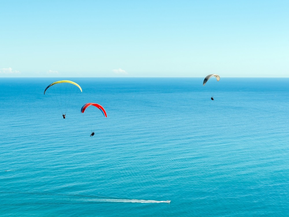 Side: Paragliding Experience By Local Expert Pilots w/Hotel Pickup | ®ExcursionMania