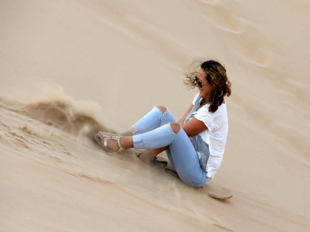 Abu Dhabi: Desert Safari with BBQ Camel Ride & Sandboarding | ®ExcursionMania