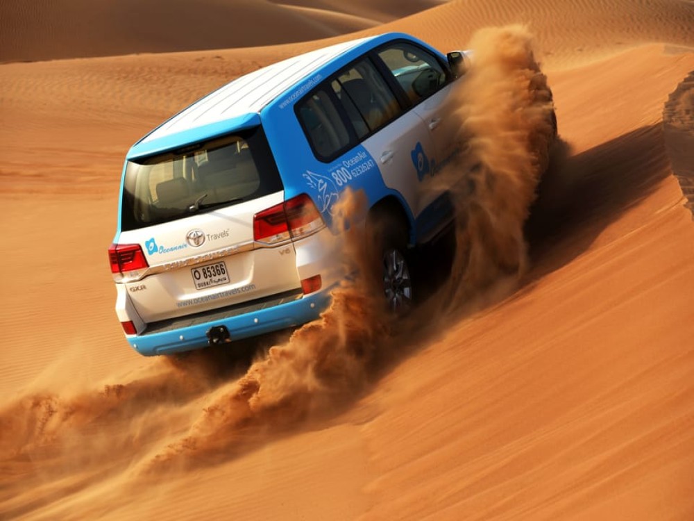 Abu Dhabi: Desert Safari with BBQ Camel Ride & Sandboarding | ®ExcursionMania