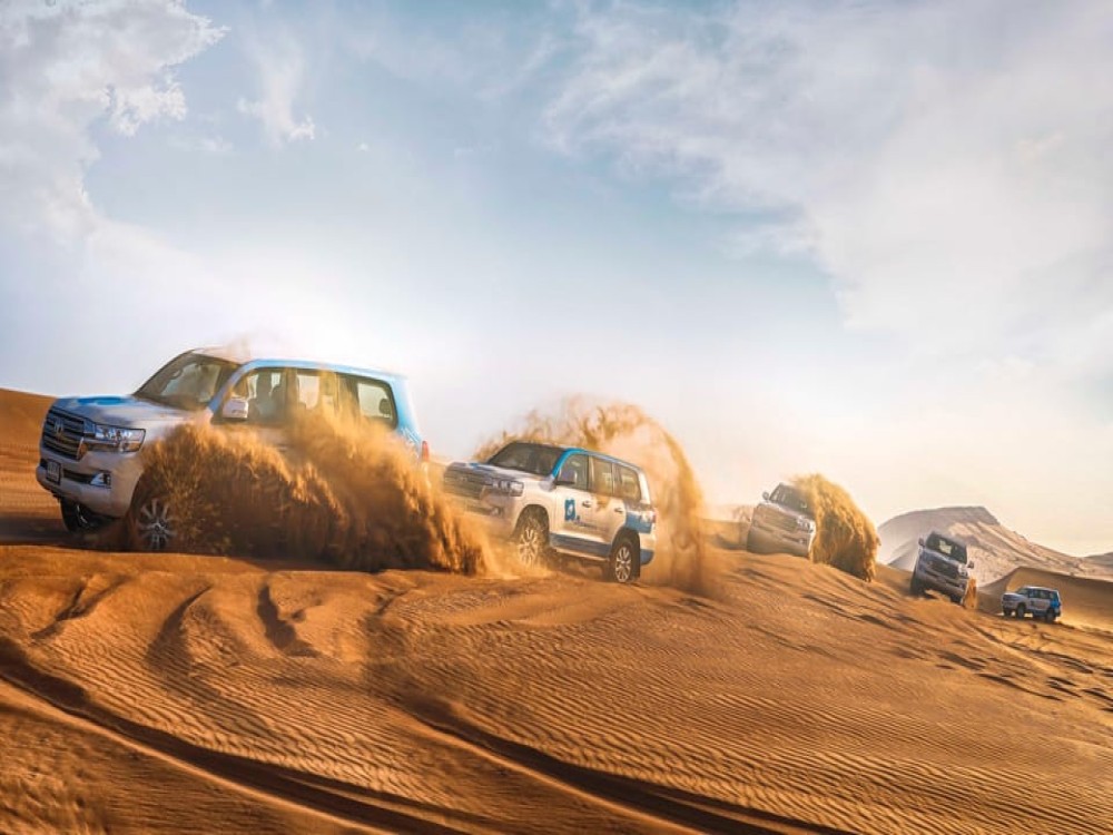 Abu Dhabi: Desert Safari with BBQ Camel Ride & Sandboarding | ®ExcursionMania
