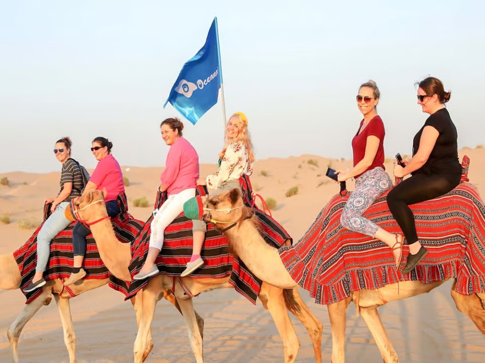 Abu Dhabi: Morning Desert Tour Camel Ride & Sandboarding | ®ExcursionMania