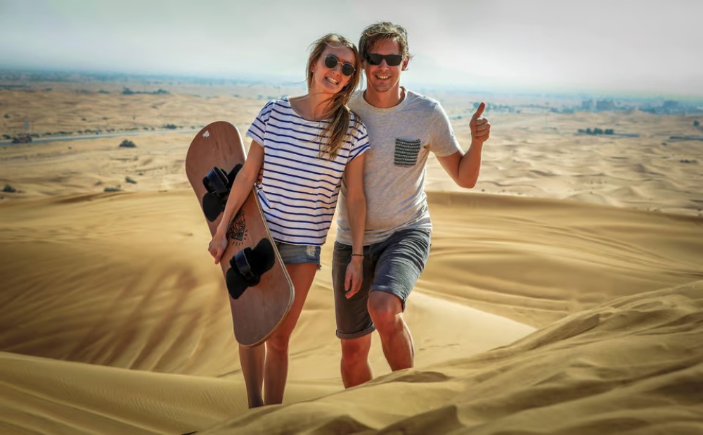 Doha: Sunset Desert Safari with Camel Ride and Sandboarding | ®ExcursionMania