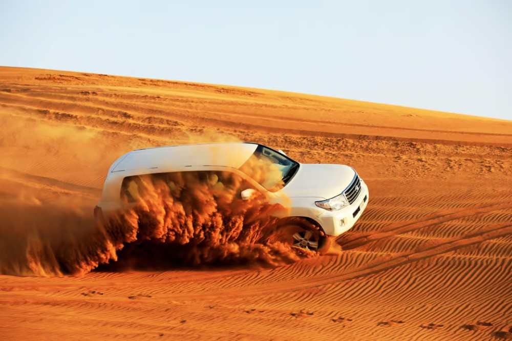 Doha: Sunset Desert Safari with Camel Ride and Sandboarding | ®ExcursionMania