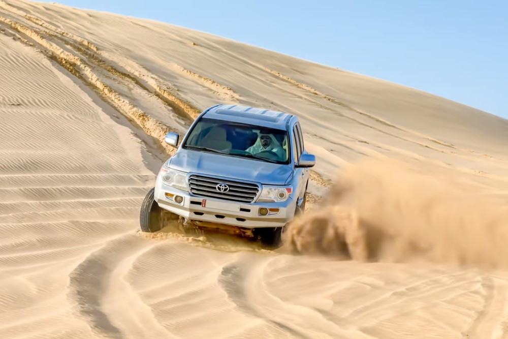 Doha: Desert Adventure w/ Dune Bashing Camels & Inland Sea | ®ExcursionMania