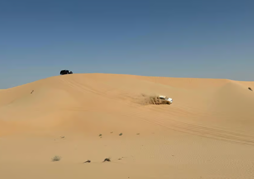 Abu Dhabi: Morning Desert Tour Camel Ride & Sandboarding | ®ExcursionMania
